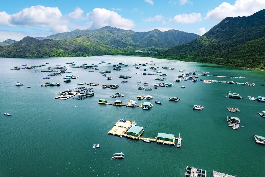 Fish farms in the sheltered bay of Three Fathoms Cove, or Kei Ling Ha Hoi, flanked on its east by the lush rolling hills of Sai Kung West Country Park. Fish farms in the sheltered bay of Three Fathoms Cove, or Kei Ling Ha Hoi, flanked on its east by the lush rolling hills of Sai Kung West Country Park.