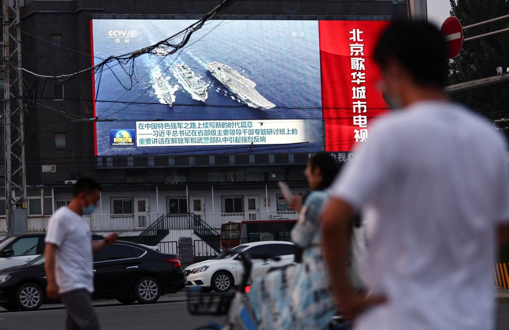 A screen shows footage of People’s Liberation Army ships during an evening news programme in Beijing on August 2. Photo: Reuters A screen shows footage of People’s Liberation Army ships during an evening news programme in Beijing on August 2. Photo: Reuters