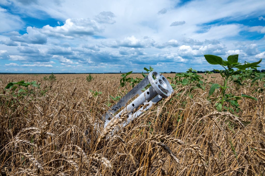 A fragment of a rocket from a multiple rocket launcher is seen embedded in a wheat field in northeast Ukraine. A drop in grain and oil supplies from the country because of Russia’s invasion will cause millions in poor nations to starve, George Monbiot says. Photo: AFP A fragment of a rocket from a multiple rocket launcher is seen embedded in a wheat field in northeast Ukraine. A drop in grain and oil supplies from the country because of Russia’s invasion will cause millions in poor nations to starve, George Monbiot says. Photo: AFP