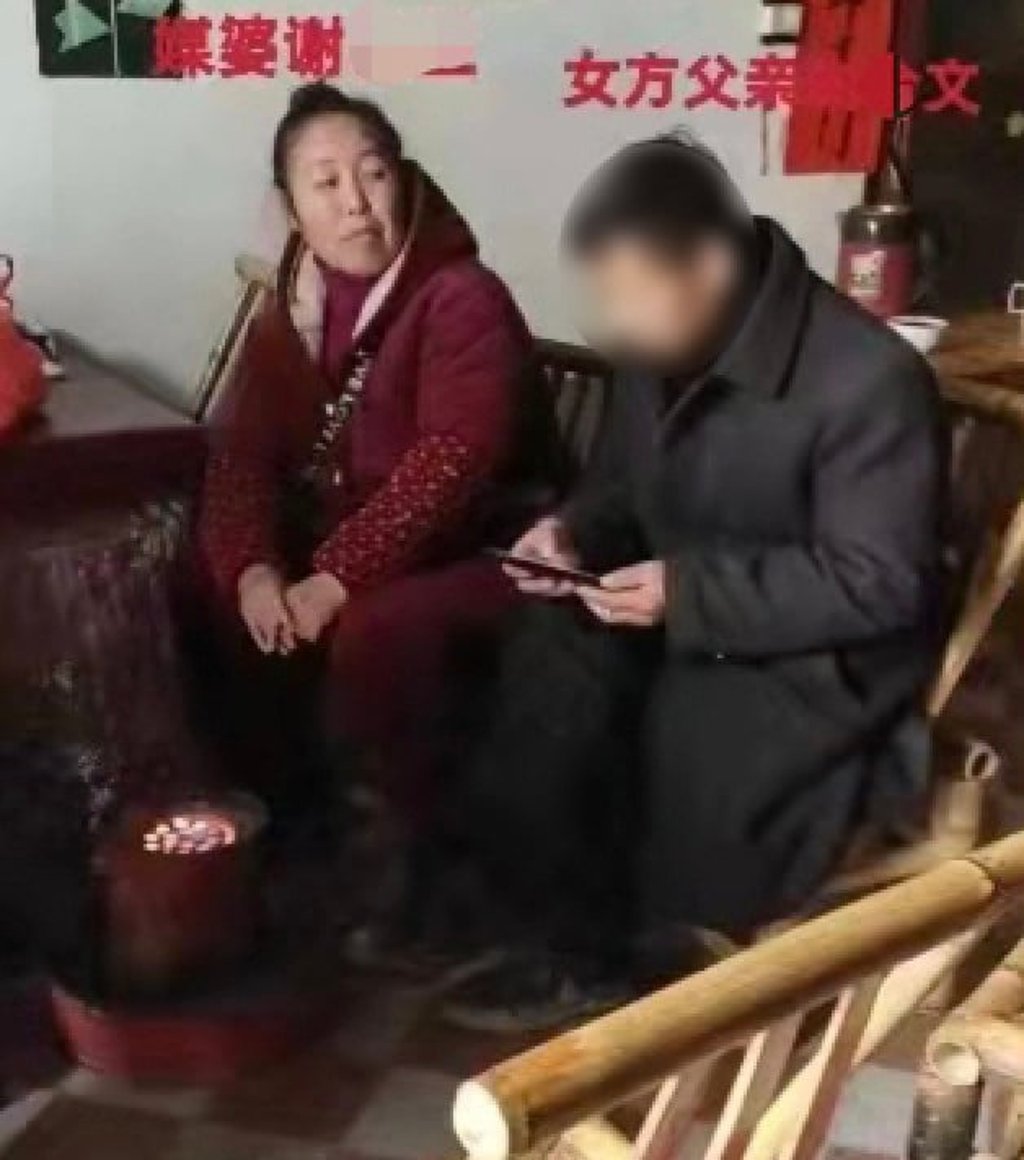The girl’s father, seen above right with a matchmaker, has been arrested, but is yet to be charged by police. Photo: Handout The girl’s father, seen above right with a matchmaker, has been arrested, but is yet to be charged by police. Photo: Handout
