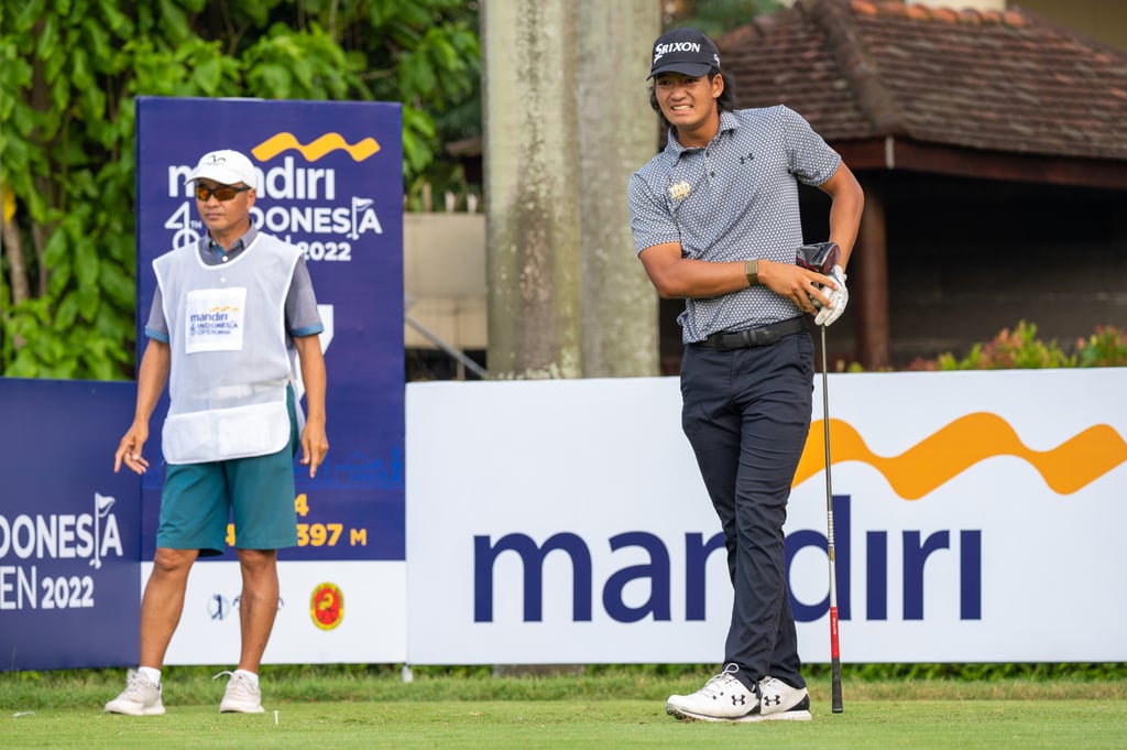 Taichi Kho with his caddie and father Victor Kho during round two of the Mandiri Indonesia Open at the Pondok Indah Golf Course. Taichi Kho with his caddie and father Victor Kho during round two of the Mandiri Indonesia Open at the Pondok Indah Golf Course.