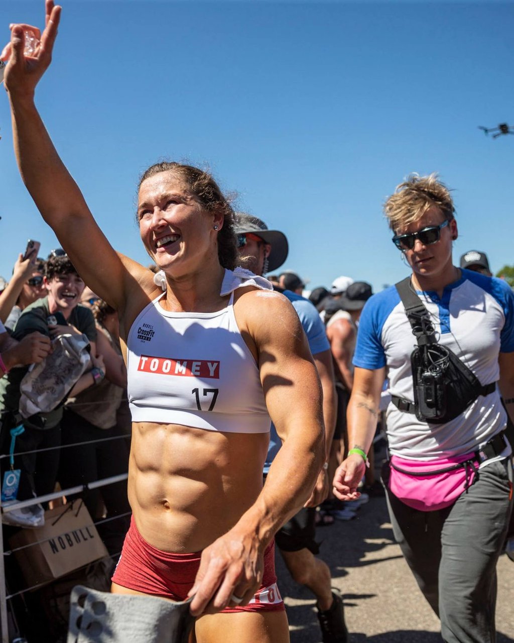 Tia-Clair Toomey waves to the fans at the 2022 CrossFit Games on day 3. Tia-Clair Toomey waves to the fans at the 2022 CrossFit Games on day 3.