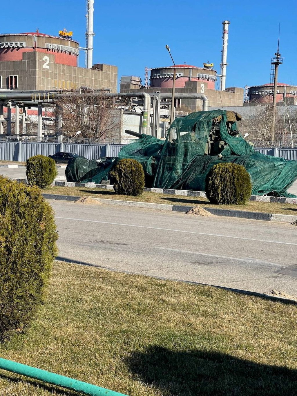 A Russian tank covered in green sheets outside the Zaporizhzhia nuclear power plant. Photo: Reuters