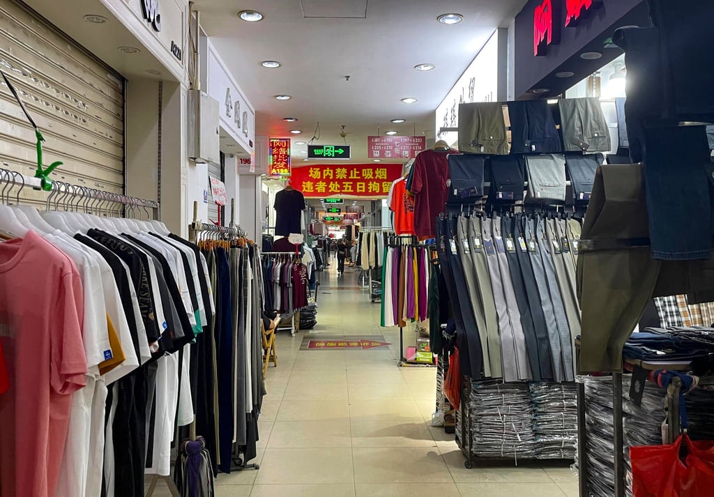 The hallways inside one of the buildings at the Qipu Road Clothing Market were quiet during a recent visit, with many shops closed. Photo: SCMP / Tracy Qu