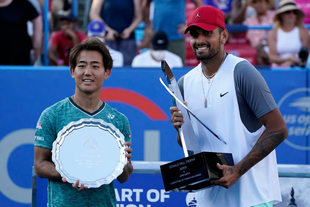 Nick Kyrgios (right) and Yoshihito Nishioka collect their prizes after the former’s victory in the final in Washington. Photo: EPA-EFE