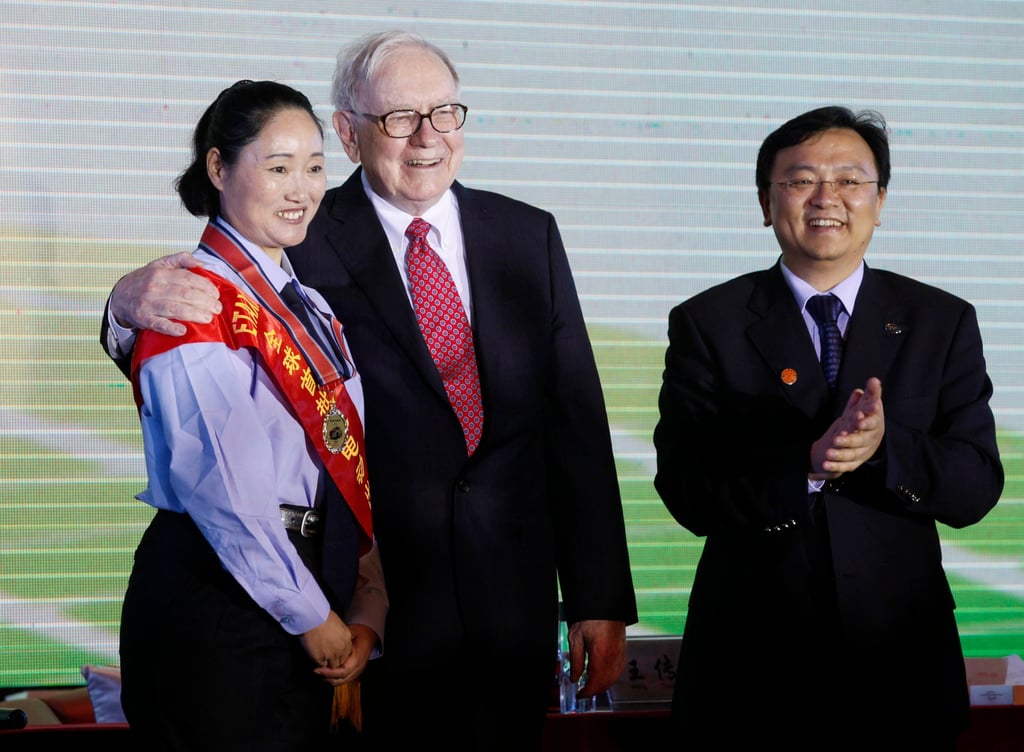 American investor Warren Buffett, centre, and Chinese tycoon, BYD Chairman Wang Chuanfu, right, pose with one of taxi drivers from the first BYD taxi team, in Shenzhen city, Guangdong province, in 2010. Photo: AP American investor Warren Buffett, centre, and Chinese tycoon, BYD Chairman Wang Chuanfu, right, pose with one of taxi drivers from the first BYD taxi team, in Shenzhen city, Guangdong province, in 2010. Photo: AP