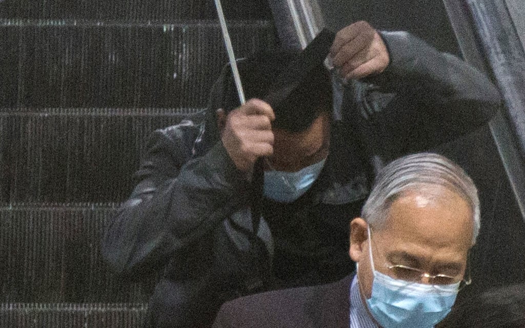 Defendant Chan Chim-tak (middle) leaves the High Court on Wednesday. Photo: Brian Wong