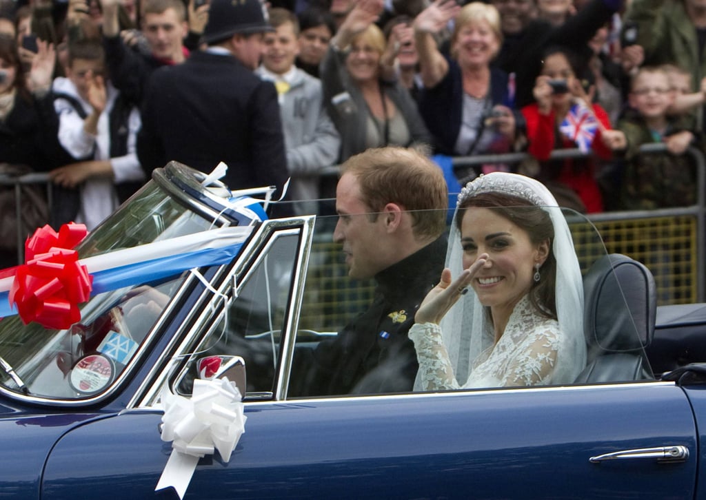 Britain’s Prince William and his wife Catherine, Duchess of Cambridge, drive from Buckingham Palace along The Mall in an Aston Martin DB6 Mark 2, after their wedding in Westminster Abbey, in central London, in 2011. Reuters/Ronen Zvulun