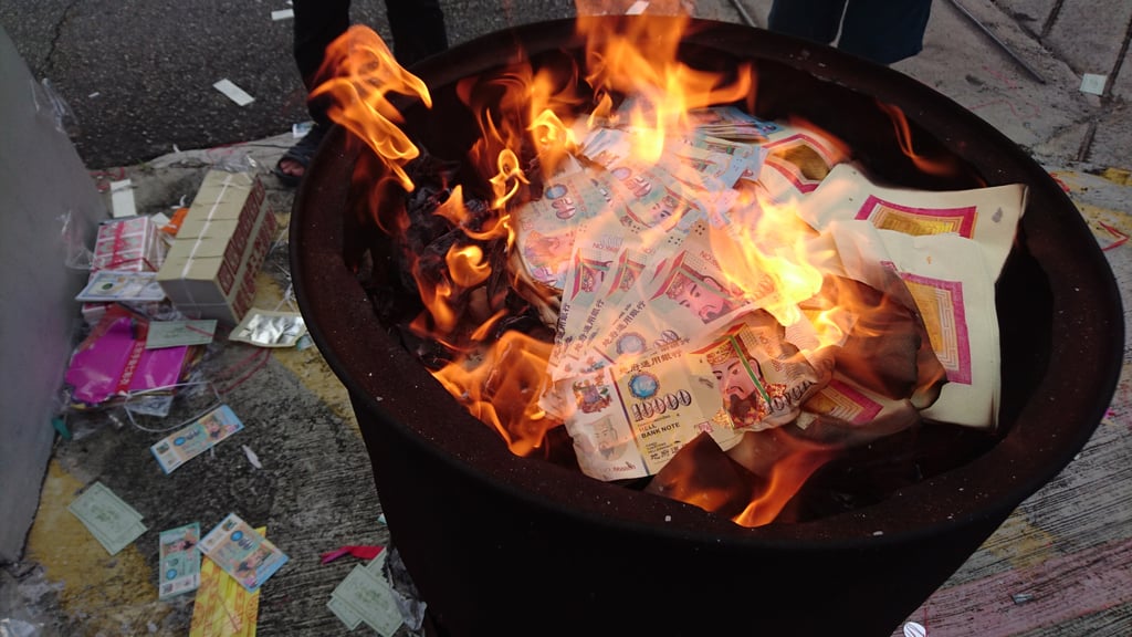 During the Hungry Ghost Festival, people honour the memories of the dead by presenting food, as well as burning “hell money”. Photo: Shutterstock