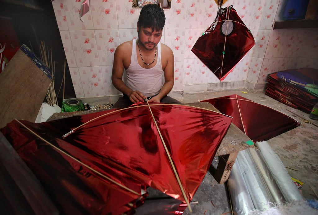 An Indian kite maker. File photo: EPA An Indian kite maker. File photo: EPA