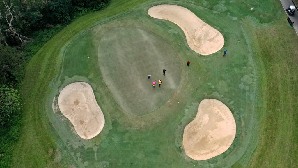 A bird’s-eye view of golfers on a green at the Hong Kong Golf Club in Fanling. Photo: Roy Issa.