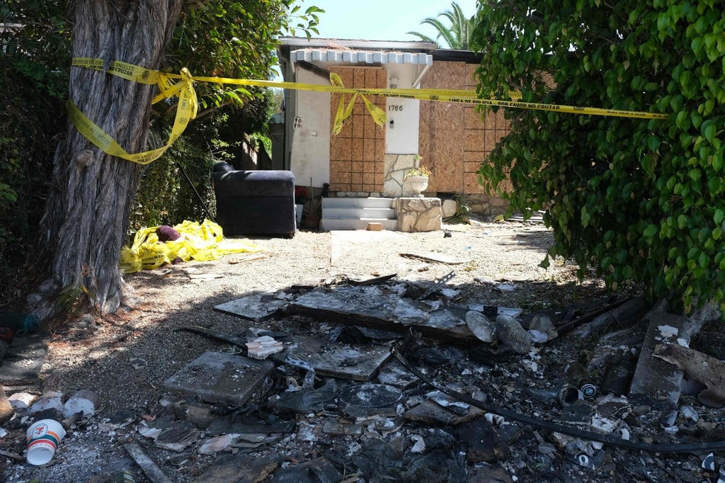 Charred debris and caution tape are seen on Monday at the site where US actress Anne Heche crashed into a building in Mar Vista, California. Photo: AFP