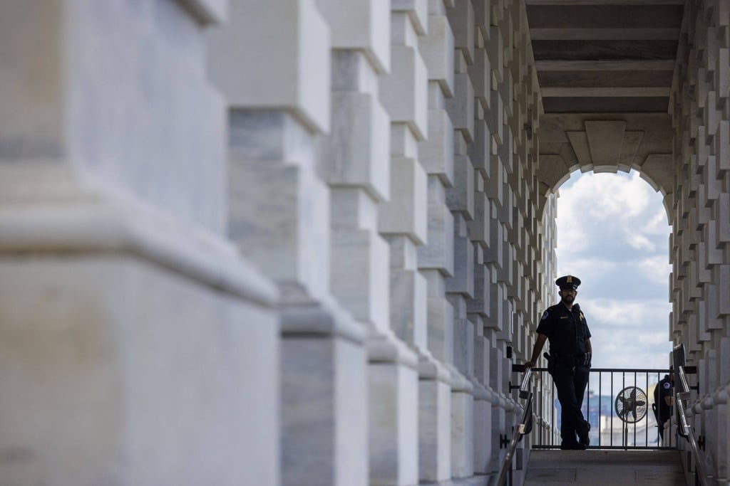 A member of the US Capitol police stands guard outside the US Capitol building on August 12. Photo: Bloomberg A member of the US Capitol police stands guard outside the US Capitol building on August 12. Photo: Bloomberg