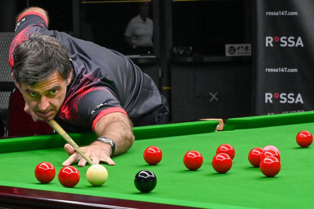 World No 1 and seven-time world champion Ronnie O’Sullivan demonstrates during a snooker lesson at his newly opened academy in Singapore on June 13, 2022. Photo: AFP World No 1 and seven-time world champion Ronnie O’Sullivan demonstrates during a snooker lesson at his newly opened academy in Singapore on June 13, 2022. Photo: AFP
