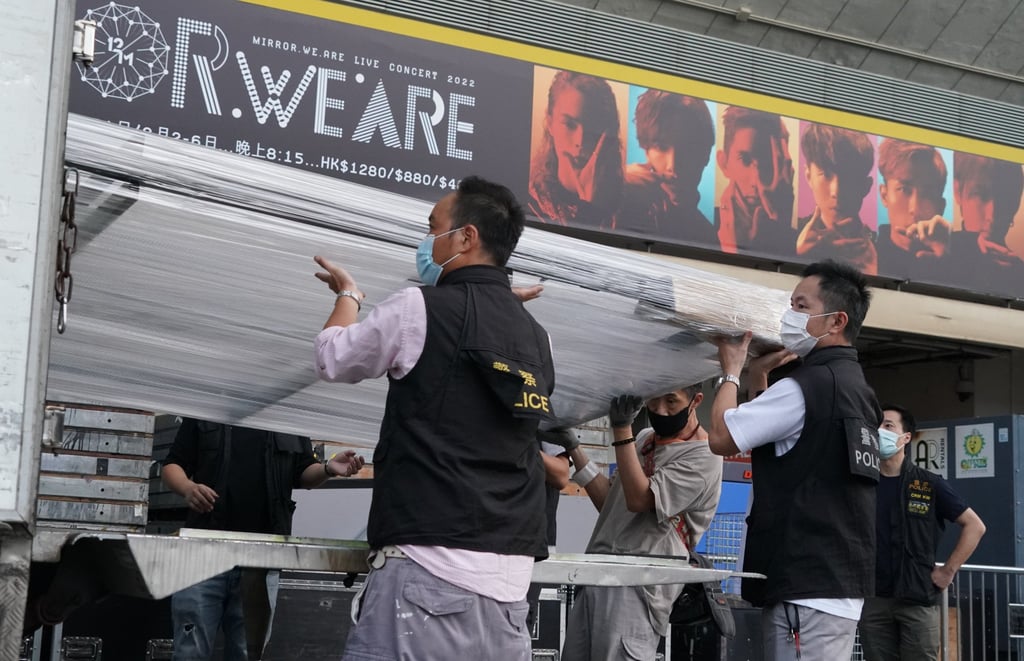Authorities collect evidence from the Hong Kong Coliseum after an accident at a Mirror concert left a dancer critically injured. Photo: Felix Wong