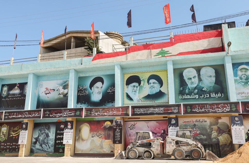 Lebanon’s Hezbollah leader Sayyed Hassan Nasrallah and Iran’s Supreme Leader Ayatollah Ali Khamenei on posters in the town of Yaroun, southern Lebanon, on Friday. Photo: Reuters