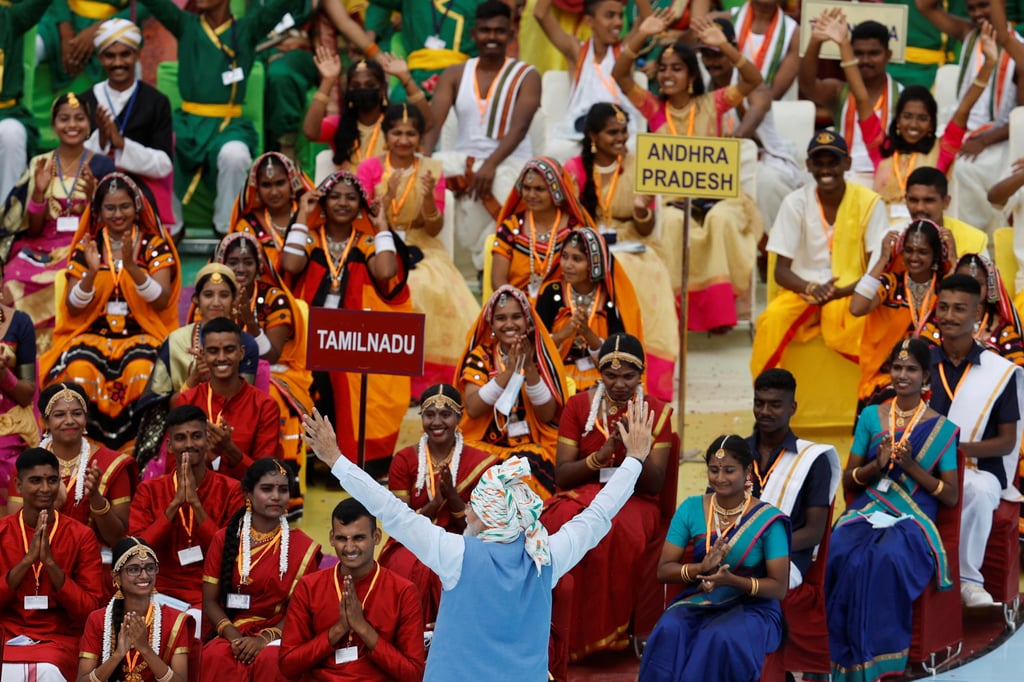 Indian Prime Minister Narendra Modi gestures to folk artists from around India on Monday after addressing the nation for the country’s 75th Independence Day celebrations. Photo: Reuters