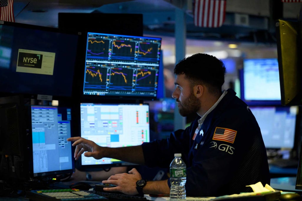 A Wall Street trader works on the floor of the New York Stock Exchange on August 5. Photo: AFP A Wall Street trader works on the floor of the New York Stock Exchange on August 5. Photo: AFP