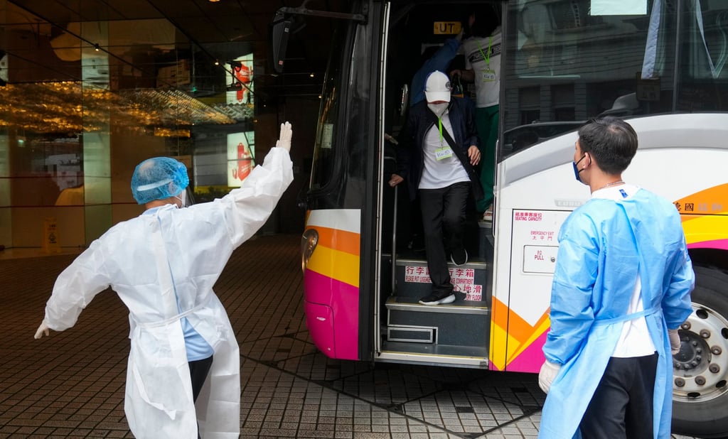 Travellers arrive at a designated quarantine hotel in Tsim Sha Tsui. Photo: Sam Tsang Travellers arrive at a designated quarantine hotel in Tsim Sha Tsui. Photo: Sam Tsang