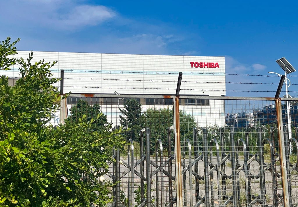 A decades-old factory of Japanese electronic giant Toshiba has been closed for nearly a year. The main entrance is lined with rusty barbed wire, and the surrounding landscaping is overrun with metre-high weeds and overgrown grass. Photo: Ji Siqi