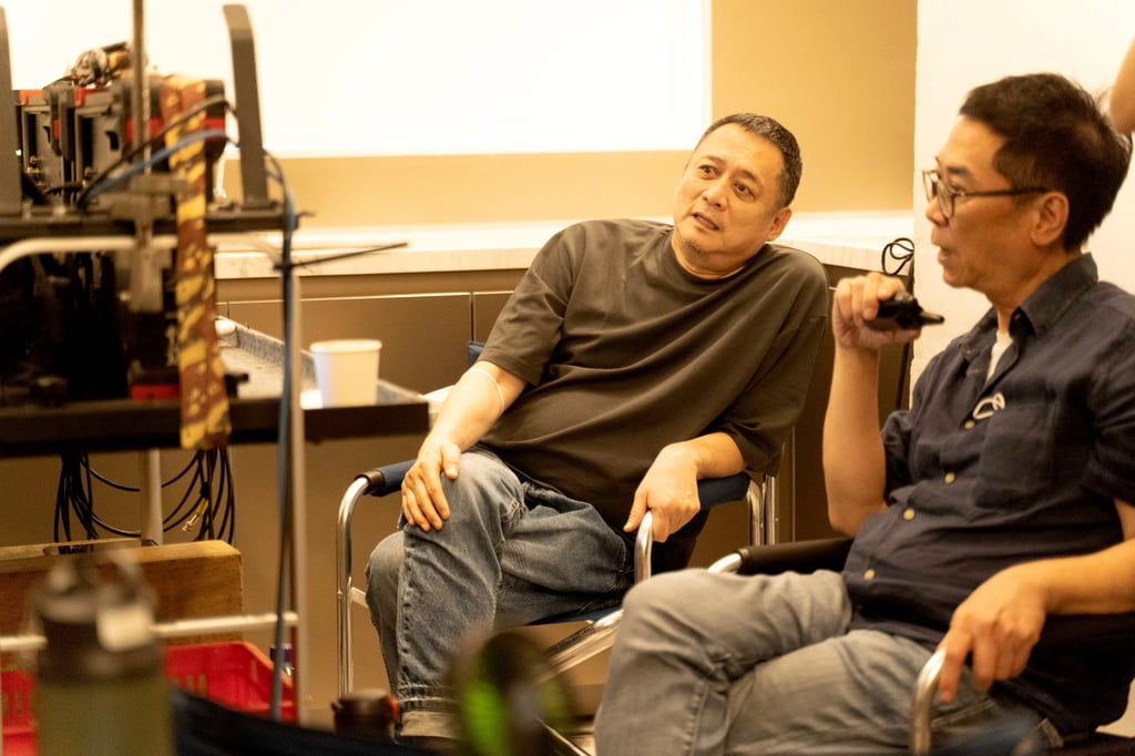 Film director Stanley Kwan (right) is joined by film editor, art director and costume designer William Chang behind the scenes at the shoot for the art film specially created for No.15 Shouson. Photo: Emperor International