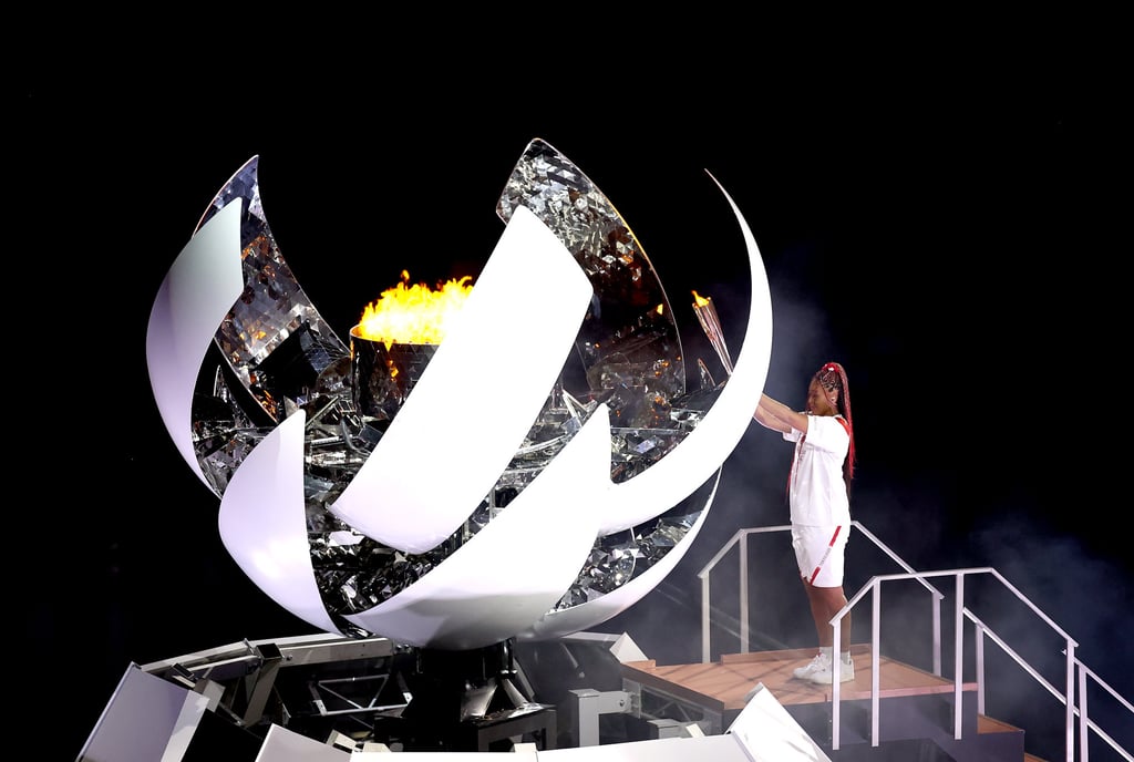 Naomi Osaka lights the cauldron at the delayed 2020 Toyko Olympics Opening Ceremony. Photo: Getty Images