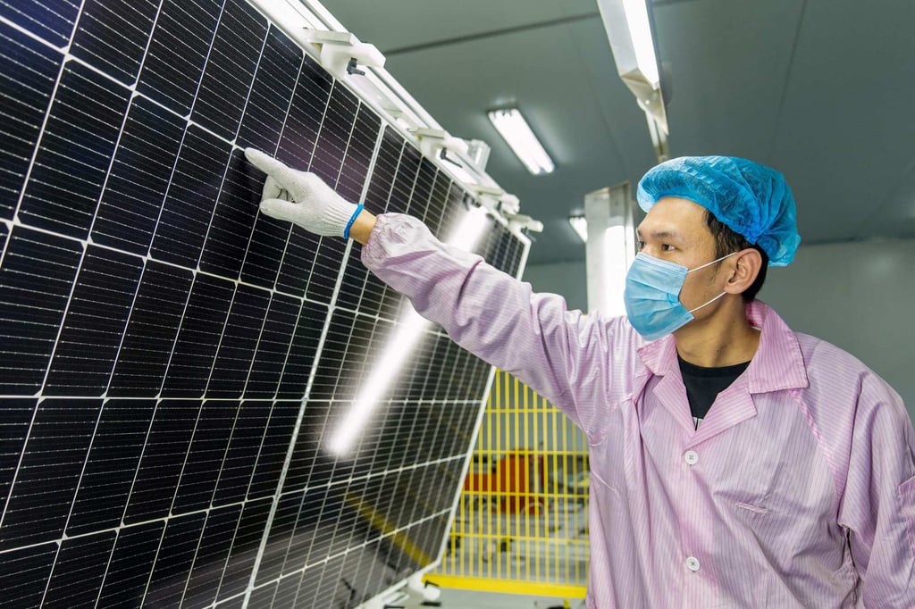A worker checks solar photovoltaic modules used for small solar panels at a factory in Haian in China’s eastern Jiangsu province on January 7, 2022. Prices for polysilicon, a key component in solar panels, could rise in coming weeks due to production disruptions in Sichuan. Photo: AFP A worker checks solar photovoltaic modules used for small solar panels at a factory in Haian in China’s eastern Jiangsu province on January 7, 2022. Prices for polysilicon, a key component in solar panels, could rise in coming weeks due to production disruptions in Sichuan. Photo: AFP
