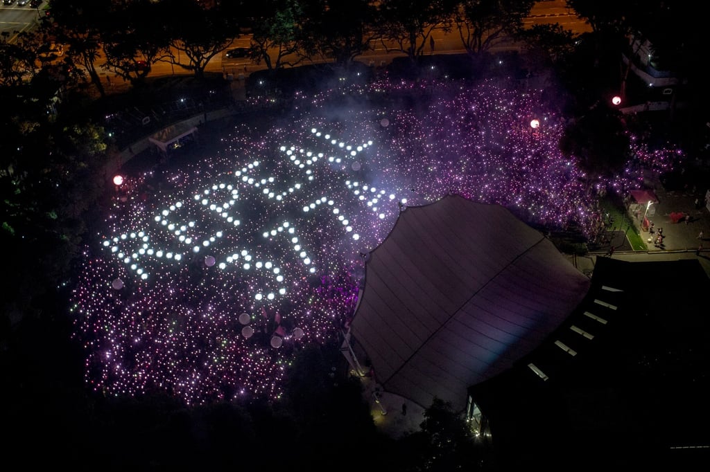 The words ‘Repeal 377A’ are formed by the crowd during Singapore’s Pink Dot pride event in June 2019. Photo: EPA-EFE The words ‘Repeal 377A’ are formed by the crowd during Singapore’s Pink Dot pride event in June 2019. Photo: EPA-EFE