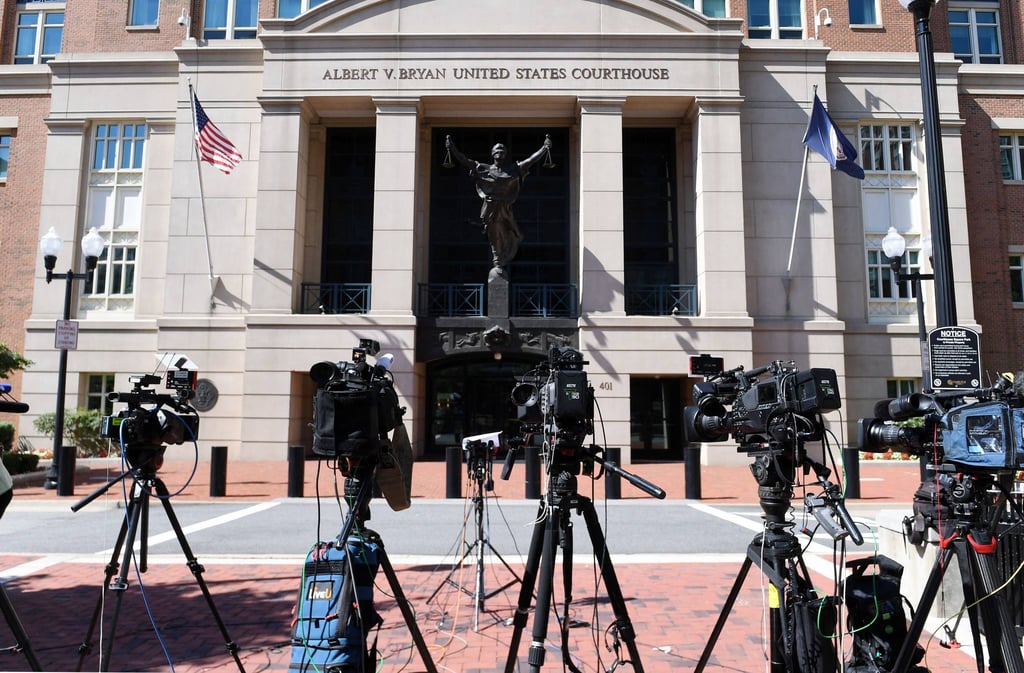 A line of cameras is seen as members of the media await the sentencing of El Shafee Elsheikh outside the courthouse in Alexandria, Virginia, on Friday. Photo: AFP