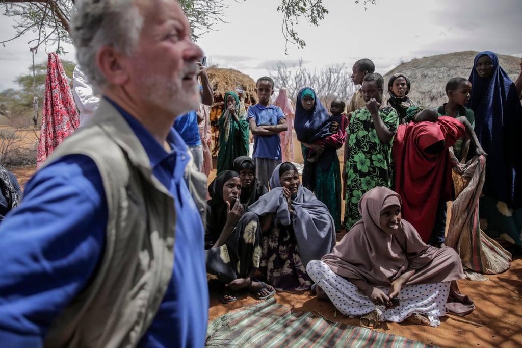 World Food Programme chief David Beasley, left, meets with villagers in northern Kenya on Friday. Photo: AP