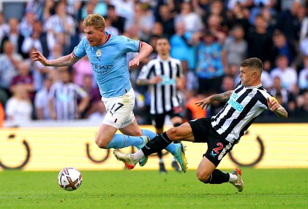 Newcastle United’s Kieran Trippier lunges to foul Manchester City’s Kevin De Bruyne in an incident that led him to be shown a red card, before it was overturned by VAR. Photo: dpa