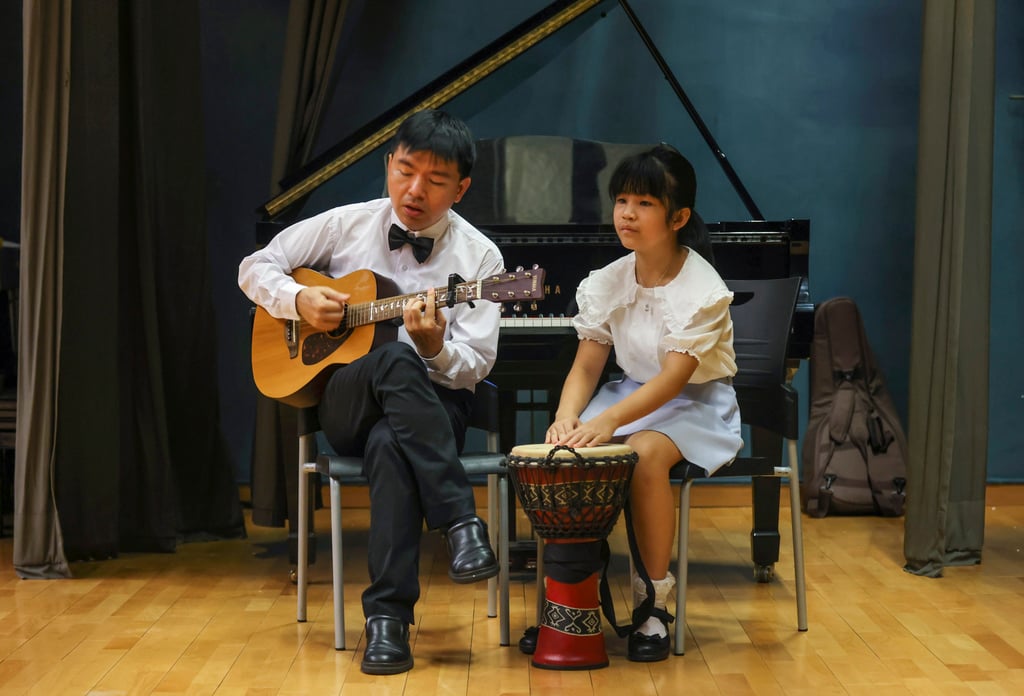 Lam Pak-Keong, with his 10-year-old daughter Hana Lam. Photo: Jonathan Wong Lam Pak-Keong, with his 10-year-old daughter Hana Lam. Photo: Jonathan Wong