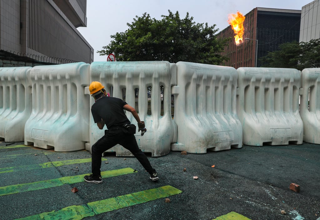 Protesters throw petrol bombs toward police officers at Central Government Offices in Admiralty on September 29, 2019. Photo: Sam Tsang Protesters throw petrol bombs toward police officers at Central Government Offices in Admiralty on September 29, 2019. Photo: Sam Tsang
