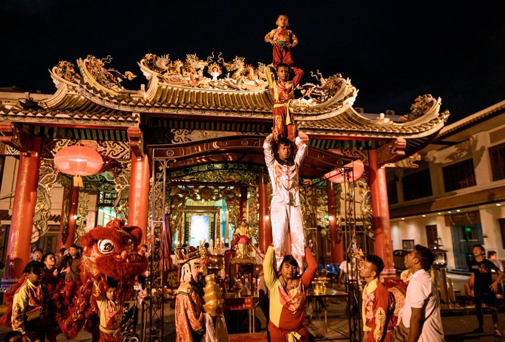 Performers celebrate the Moon Praying Festival in Thailand in 2019. Photo: AFP