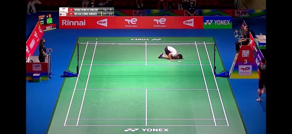Vincent Wong kisses the court after his final match at the World Championships. Photo: Handout Vincent Wong kisses the court after his final match at the World Championships. Photo: Handout