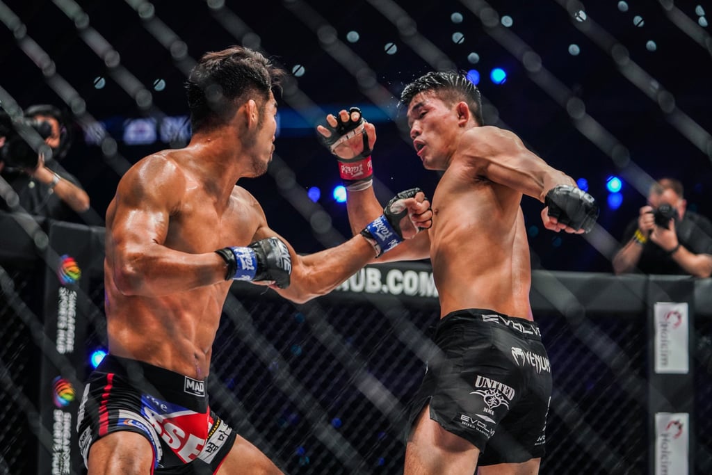 Christian Lee (right) winds up a left hook against Ok Rae-yoon at ONE: Revolution.