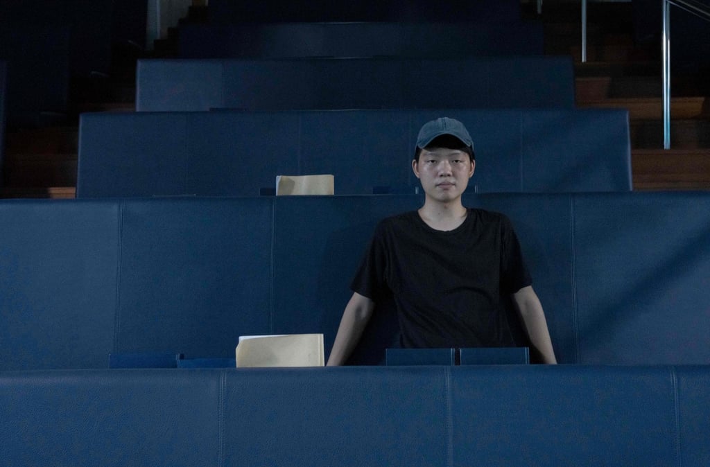 Army reservist Henry Cheng sits in a Taipei church. Like others, he said he felt ill-prepared for war. Photo: AFP