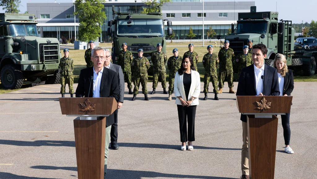 Nato Secretary General Jens Stoltenberg, left, and Canadian Prime Minister Justin Trudeau at the Royal Canadian Air Force base in Cold Lake, Alberta, Canada on Friday. Photo: Nato / AFP