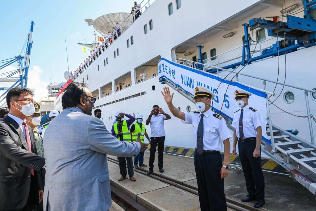 Captain Zhang Hogwang of China’s research and survey vessel, the Yuan Wang 5, waves after disembarking from the ship upon arrival at Hambantota port on August 16, 2022. Photo: AFP/File