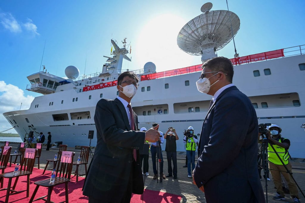 Chinese ambassador Qi Zhenhong (left) gestures as the Yuan Wang 5 arrives at Hambantota. Photo: AFP