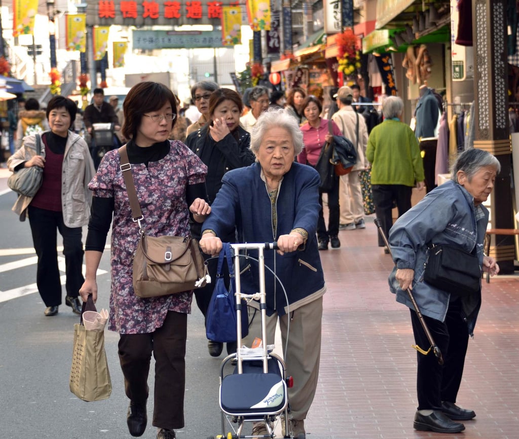 Elderly people stroll through a shopping precinct in Tokyo. Residents of the nursing home in Kitakyushu have greeted the ‘hired’ babies by striking up conversations with them and offering them hugs. Photo: AFP Elderly people stroll through a shopping precinct in Tokyo. Residents of the nursing home in Kitakyushu have greeted the ‘hired’ babies by striking up conversations with them and offering them hugs. Photo: AFP