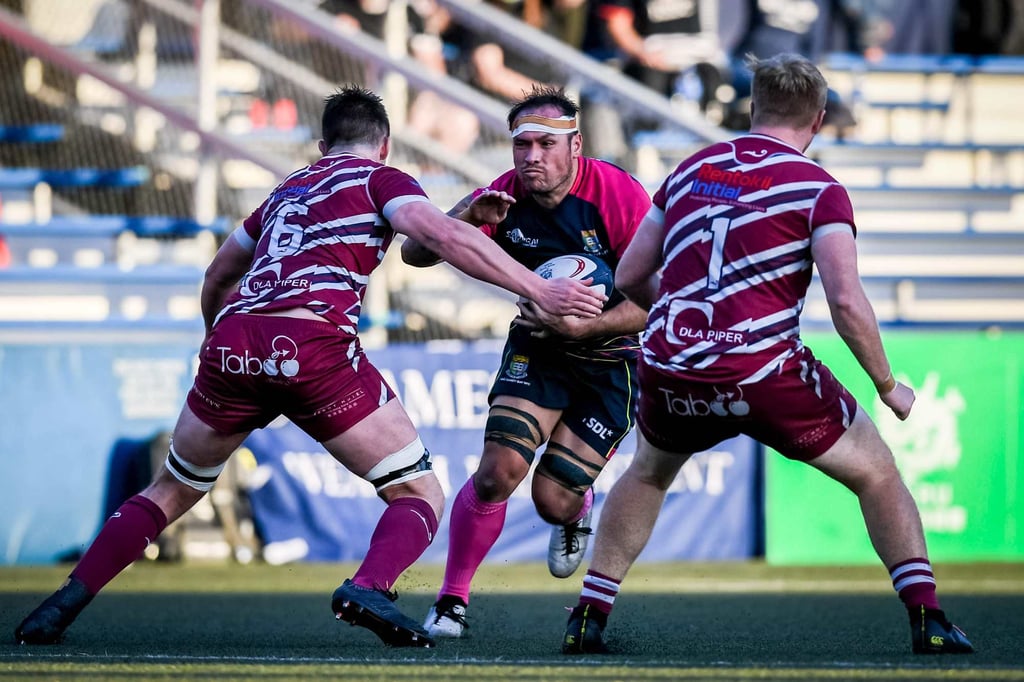 Sandy Bay No 8 Simon Leung in action against Kowloon. Photo: HKRU