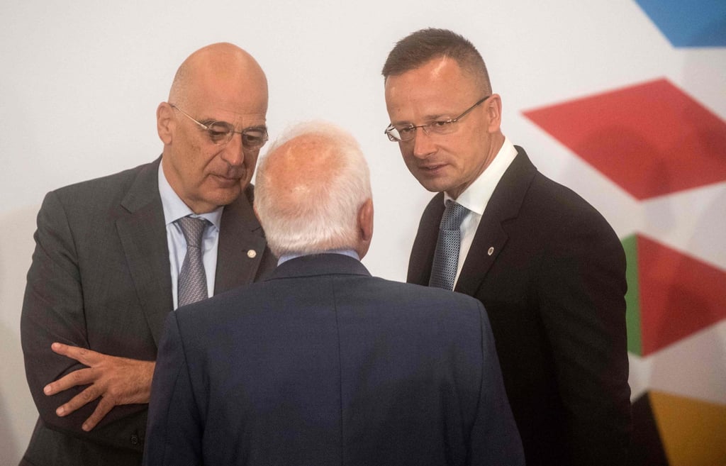 Greece’s Foreign Minister Nikos Dendias (left) and Hungary’s Foreign Minister Peter Szijjarto (right) talk with the European Union’s High Representative for Foreign Affairs and Security Policy Josep Borrell in Prague, Czech Republic on Wednesday. Photo: AFP Greece’s Foreign Minister Nikos Dendias (left) and Hungary’s Foreign Minister Peter Szijjarto (right) talk with the European Union’s High Representative for Foreign Affairs and Security Policy Josep Borrell in Prague, Czech Republic on Wednesday. Photo: AFP