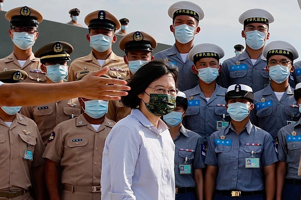 Taiwan President Tsai Ing-wen walks next to naval officers during a visit to Penghu, on Tuesday. Following the visit of US House Speaker Nancy Pelosi in early August, China stepped up its military exercises near the island. Photo: EPA-EFE