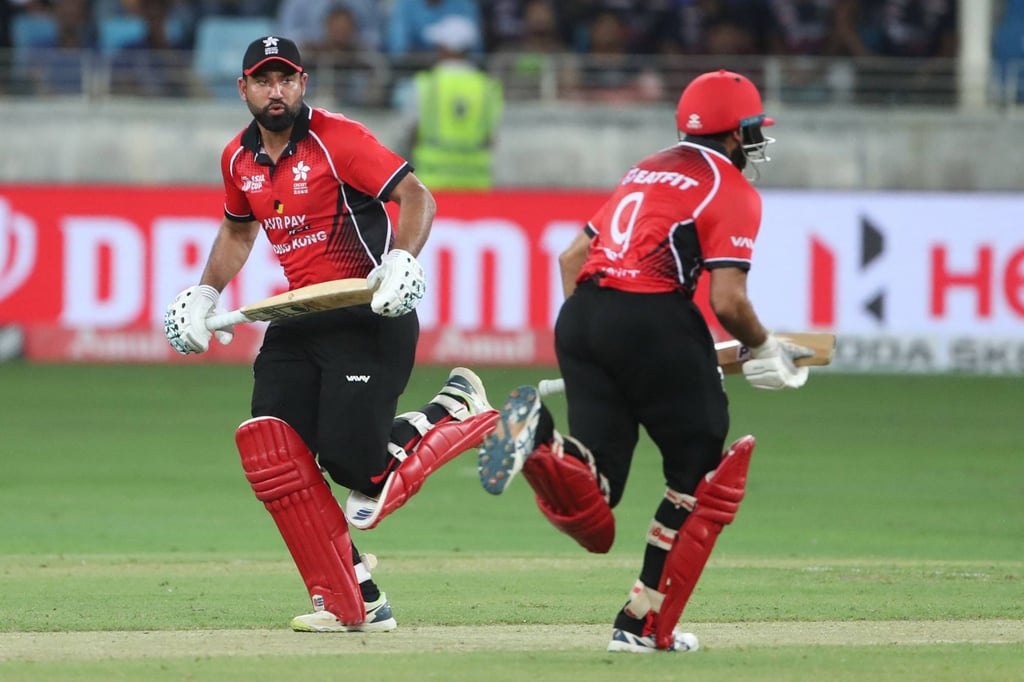 Hong Kong’s Babar Hayat (left) and Kinchit Shah take a run during the Asia Cup Twenty20 match against India in Dubai. Photo: AFP Hong Kong’s Babar Hayat (left) and Kinchit Shah take a run during the Asia Cup Twenty20 match against India in Dubai. Photo: AFP