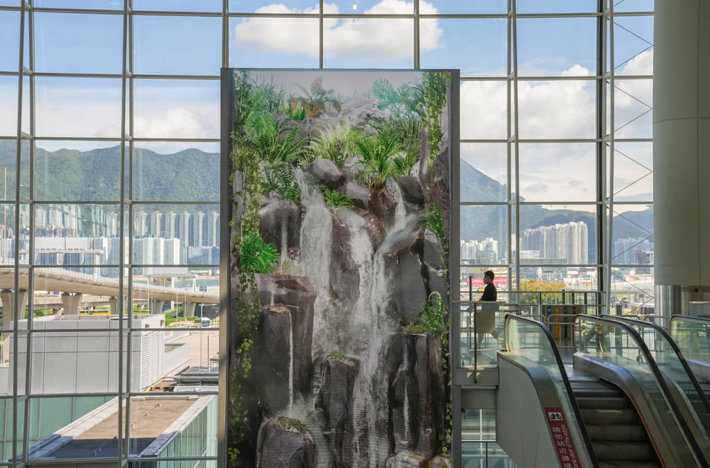 A giant monitor screens a waterfall in the main terminal at Hong Kong International Airport. Photo: Sam Tsang