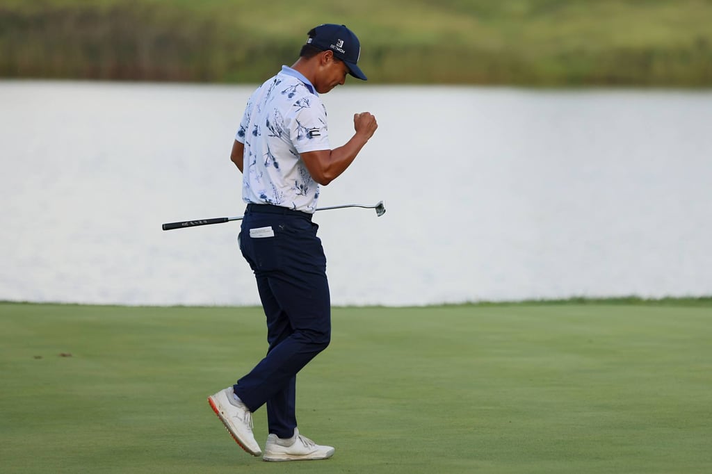 Justin Suh of the United States celebrates making a putt in the final round at Victoria National Golf Club. Photo: AFP
