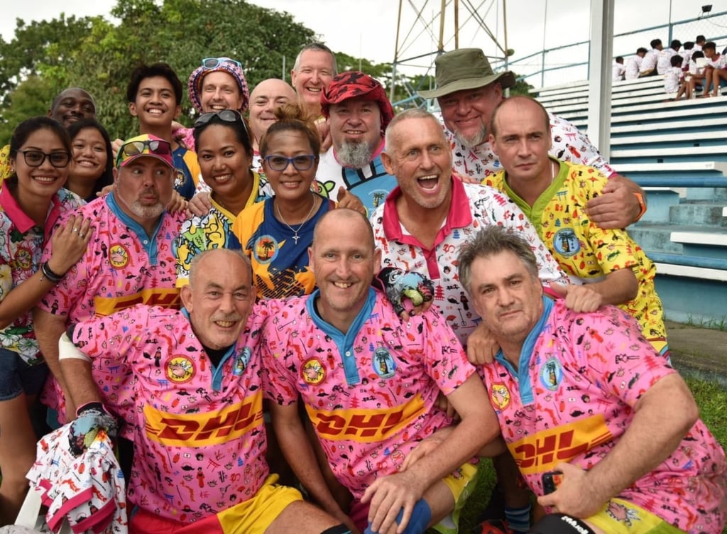 Tournament director Andrew Green (middle front) with the Pot Bellied Pigs Football Club. Photo: Ross Bendix Tournament director Andrew Green (middle front) with the Pot Bellied Pigs Football Club. Photo: Ross Bendix