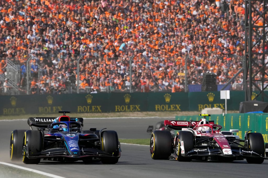 Alfa Romeo’s Zhou Guanyu (right) steers side-by-side with Williams driver Alexander Albon during the second practice before the Dutch Grand Prix. Photo: AP