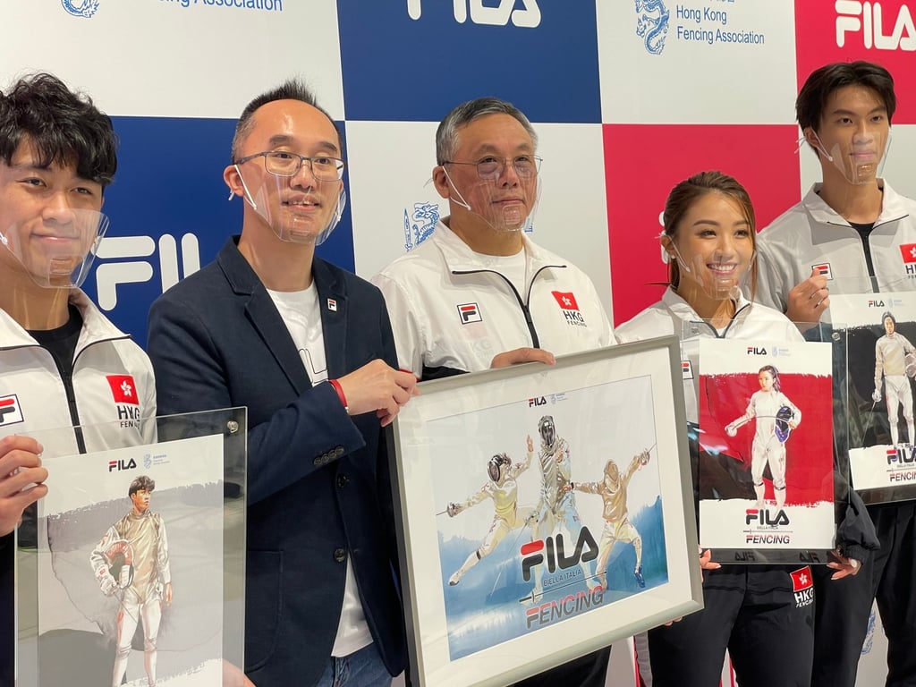 Fencing Association chairman Yeung Wing-sun (centre) and fencers attending a joint-venture programme. Photo: Chan Kin-wa